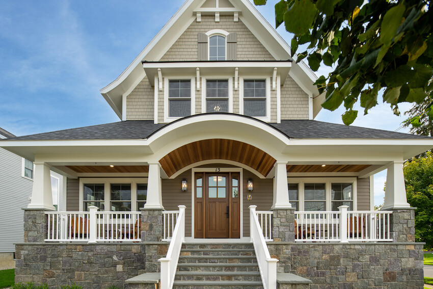 A porch that has been built with pressure treated built in benches by Brawner Renovations for a home in Marietta.