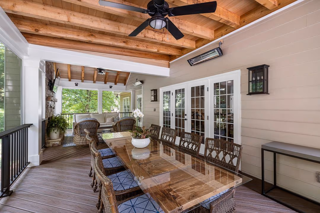 A porch that has been built with pressure treated built in benches by Brawner Renovations for a home in Marietta.
